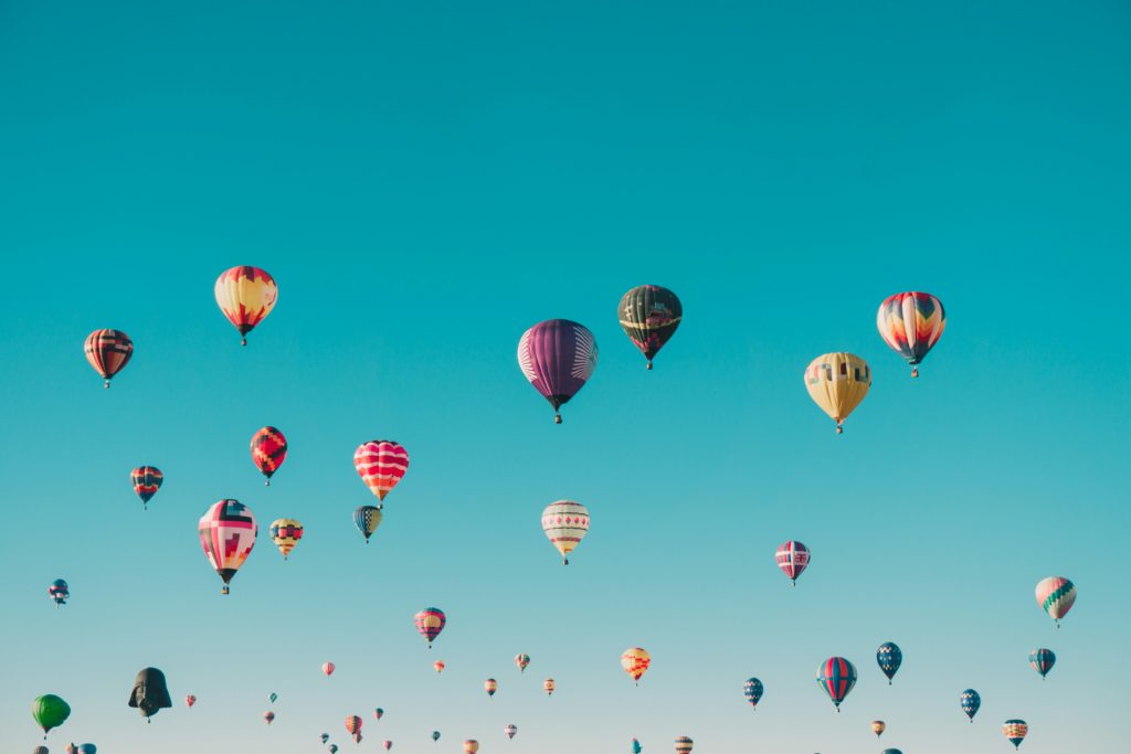 Hot air balloons rise in the sky